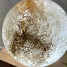 Load image into Gallery viewer, Clear Quartz 60mm Rutile and Golden Healer Inclusion Sphere
